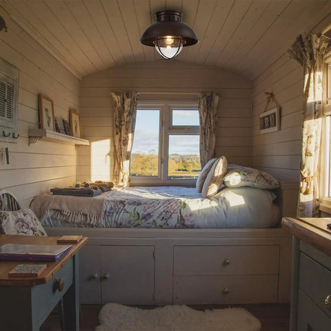 Cozy room with Outdoor Farmhouse Ceiling Light 10 Inch Flush Mount in Oil Rubbed Bronze With Metal Cage and Seeded Glass.