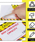 TopShelf Heavy Duty Pallet Rack Capacity Labels 100 Pack featuring 3x4 inch waterproof PVC max load warning sticker being peeled.