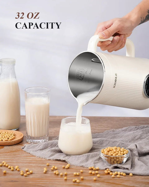 8 In One Nut Milk Maker And 32 Oz Self Cleaning Automatic Blender pouring almond milk into glass on wood table.