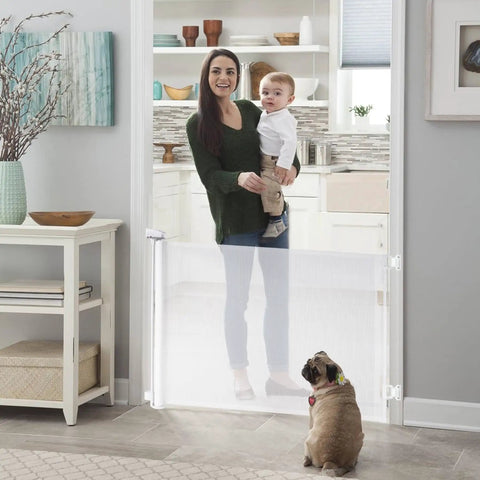 Mother holding child near Retractable Baby Gate For Stairs And Doors Indoor Outdoor Safety Gate Extends Up To 55 Inches Wide And 35 Inches High