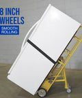 Heavy Duty Hand Truck 1200 Pound Capacity Appliance Dolly With Convertible Two Or Four Wheel Design in use with 8 inch wheels.
