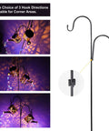 2 Pack Solar Watering Cans With Cascading Lights on shepherd hooks; metal retro lanterns with daisy pattern and auto light sensor.