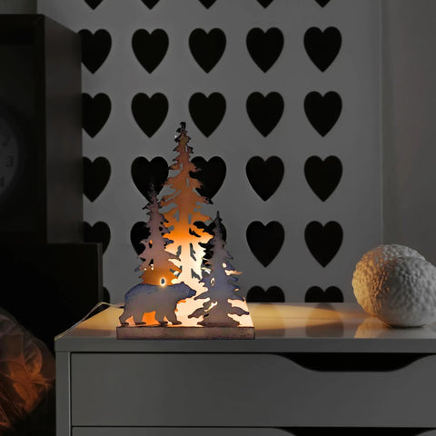 Woodsy Bear Silhouette Table Lamp For Cabin And Lodge Decor lit on nightstand showing metal silhouette of bear and trees