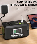 Beast 24000mAh Portable Power Bank With Dual 150W Peak AC Outlets And 8 Ports connected to laptop showing charging status