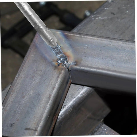 Close-up of 12 Pc Aluminum Filler Rods Welding Sticks for Reliable Low Temp Welds in use on metal surface corner