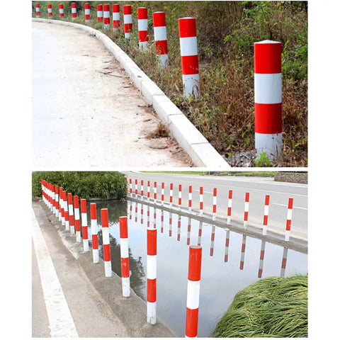 Gotta Have These Rock Solid Steel Traffic Cones And Parking Bollards, High Visibility Reflective Road Barrier Posts For Driveway Protection, Easy Setup 24 Inch Safety Markers Built Tough along a winding road and near a water body.