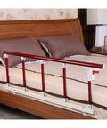 Portable Folding Bed Rail With Red Wood Grain Handle attached to bed