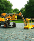 Self Propelled Telescopic Boom Lift Job Site Workhorse For High Reach Commercial Construction And Routine Maintenance Chores With Easy Roll Out Handling And No Sweat Operation, shown from side with yellow and gray colors.