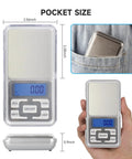 Compact Digital Pocket Scale With 500G Capacity And 0.01G Precision In A Stainless Steel Panel next to hand and pocket for scale