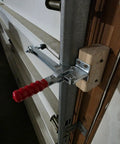 Pro Grade Vertical Toggle Clamp Featuring A Quick Release Lever And Unmatched 400 Lbs Holding Capacity For Rock Solid Workshop Clamping And No Sweat Assembly Jobs mounted on wood with red handle