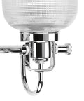 Close-up of clear double prismatic glass shade on polished chrome finish of Two Light Coastal Bath Vanity Light From Archie Collection P2991 15