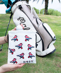 Premium Leather Golf Pouch With Drawstring Closure For Balls And Tees in front of golf bag on grass