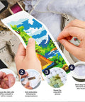 Person crafting with Camping Theme DIY Cross Stitch Bookmark Kit For Beginners, showing mountain view design in progress.