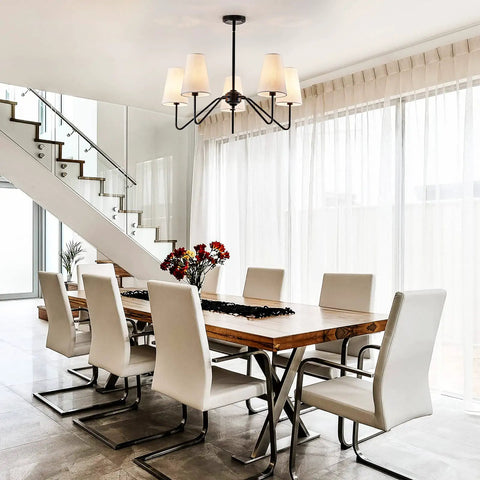 Dining room with Totally Chic Modern Farmhouse Small Chandelier In Black Finish over table, stylish and vintage-inspired.
