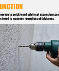 Drilling wall using Pro Grade Heavy Duty Alloy Steel Screw Anchor Expander For Hollow Walls with Greenlee 84305 compatibility.
