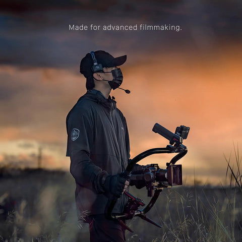 Cinematographer using Basic Ring Grip Plus Control Kit for DJI RS2 RS3 Pro RS4 RS4 Pro RS5 Wireless Gimbal in field at sunset.