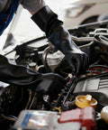 User wearing Heavy Duty Chemical Resistant Rubber Gloves With Killer Anti Slip Grip Long Cuff working on a car engine.