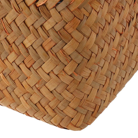 Close-up of natural woven texture of a Spacious Open Top Seagrass Woven Storage Basket With Heavy Duty Handles For Kitchen Farmhouse Pantry Bathroom Towels Cosmetics And Hassle Free Daily Organization Goals.