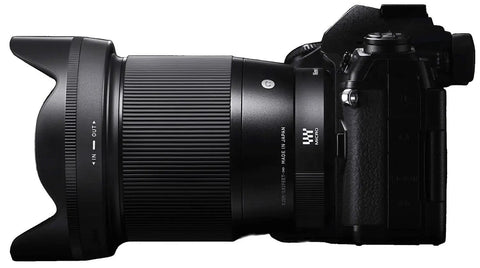 Side view of 16mm F1.4 DC DN Contemporary Wide Angle Prime Lens For Sony E Mount attached to a camera body.
