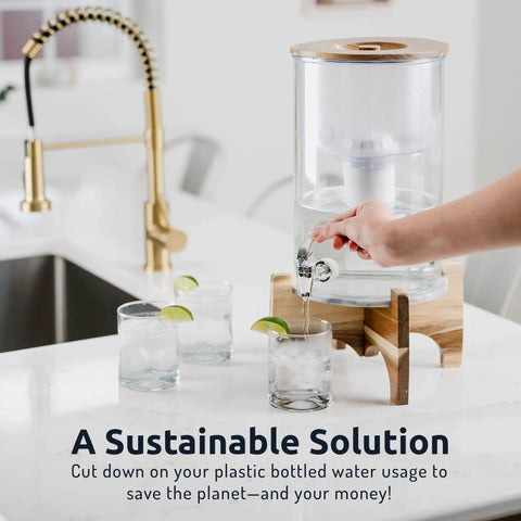 Blue Alkaline Water Filter Replacement for All Pitcher and Dispenser Filtration Systems BPA Free in use with dispenser on countertop.