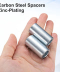 Galvanized Steel Spacers Ten Pack Heavy Duty Round Metal Spacers One Half Inch Bore Three Quarter Inch Outer Diameter One And A Half Inch Length Unthreaded Standoff Bushings Plain Finish For M12 Screws And Bolts, two zinc-plated spacers in hand