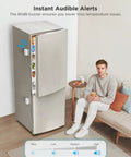 WiFi Refrigerator Thermometer With Alarm, 2 Pack, Remote Temperature Monitoring via App on modern fridge next to seated man