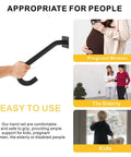Hand gripping a black wall mount handrail, showcasing its use as Two Pack Half U Metal Handrails For Outdoor Steps And Indoor Stairs Wall Mount Safety Rail With Hardware Badass Grip For Elderly Rock Solid Build Smooth Install Heavy Duty Stair Support Rig.