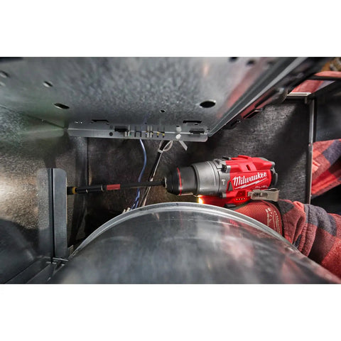 M12 Fuel Half Inch Hammer Drill Driver with Brushless Motor being used in tight space for heavy duty job, ultra lightweight design.