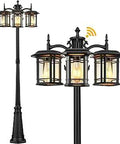 Triple Head Outdoor Lamp Post Light With Dusk To Dawn Sensor in black aluminum with three illuminated heads.