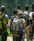 Group hiking with backpacks in forest, ideal to use Three Pack Fire Starter For Camping And Emergency Prep, Waterproof Pouches.