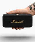 Emberton II Portable Bluetooth Speaker With 360 Degree True Stereophonic Sound, compact in hand, rugged black and brass finish