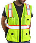 Built Tough Heavy Duty Reflective Safety Vest With 3M Tape And Reinforced Stitching Breathable Yellow Mesh Hella Visible For Construction Crews And Surveyors Zippered Front With Utility Pockets XL worn by a person, showing front pockets and mesh design.
