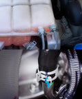 Close-up of 20 Piece Fuel Line Clamps Set for Automotive Hoses attached to engine, showcasing spring band clamps in use.