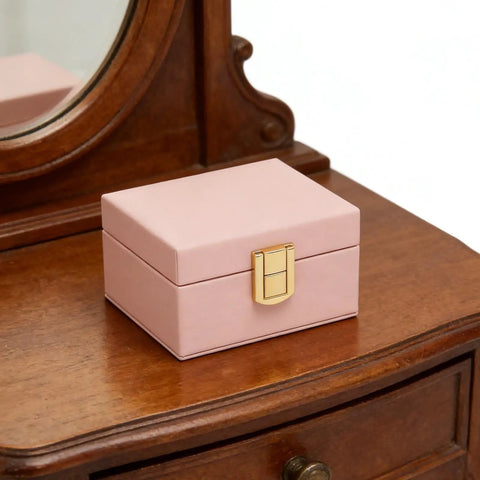 Rock Solid Lockable Metal Box Latches Gold Surface Mount Snap Fasteners on a pink wooden jewelry box for secure storage.