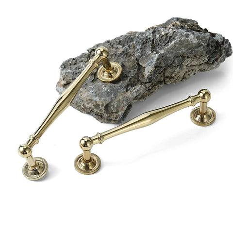 Premium Brass Cabinet Pull And Drawer Knob Set With Modern Grooved Base Design Available In Antique Brass Gold And Chrome Finishes For Kitchen, Bathroom, And Closet Hardware 2 Pack displayed on stone