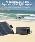 Ultra Quiet 1024Wh LiFePO4 Portable Power Station with solar panel charging a DJI drone on the beach.