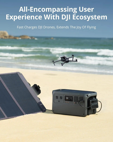 Ultra Quiet 1024Wh LiFePO4 Portable Power Station with solar panel charging a DJI drone on the beach.