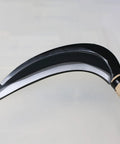 Close-up of Long Handle Weeding Sickle with Razor Sharp Japanese Carbon Steel Blade for stand-up weeding, wooden handle detail.