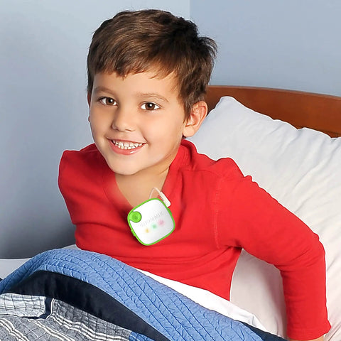 Award Winning Bedwetting Alarm For Kids And Deep Sleepers With Loud Tones And Strong Vibes Doctor Recommended Pediatric System That Cycles Through Five Alarm Sounds For Faster Nighttime Dryness on a smiling child in bed