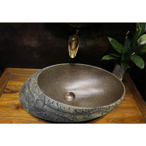 USZWBY Bathroom Vessel Sink, Undermount Sink Countertop Sink Ceramic Vessel Sink Stone Texture Bathroom Sink, Unique Shape Art Basin with a smooth, textured design on a wooden countertop.