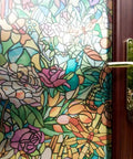 Close-up of door with Self-Adhesive Privacy Glass Window Film In Spring Chapel Tulia Pattern, colorful floral design, sunlight.