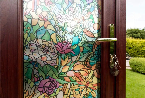 Close-up of door with Self-Adhesive Privacy Glass Window Film In Spring Chapel Tulia Pattern, colorful floral design, sunlight.