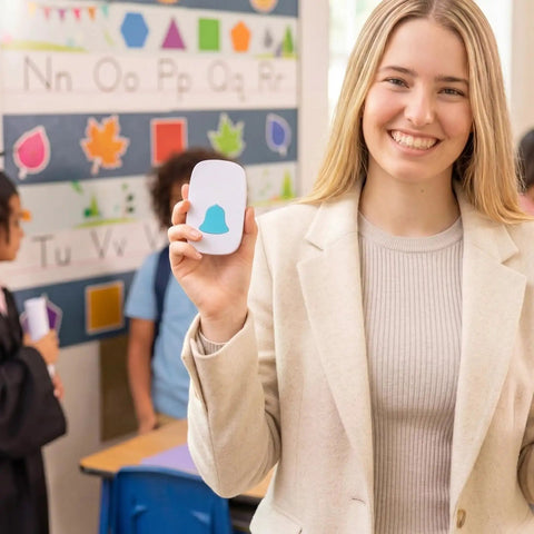 Teacher holding Attention Grabbing Classroom Doorbell Set With 4 Push Buttons And 1 Receiver Waterproof Wireless Buzzer