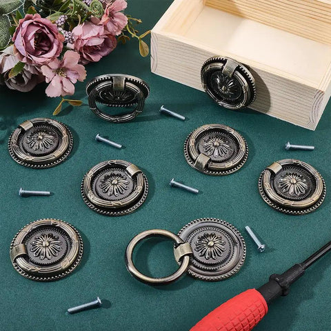 Antique Bronze Drawer Pull Ring Set 8 Pack 2.2 Inch Alloy Cabinet Knobs with screws and tools displayed on a table