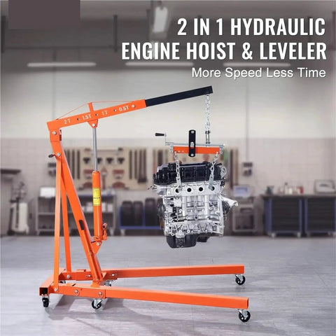 Heavy Duty Hydraulic Engine Hoist With Control Levers 2 Ton 4400 Lbs lifting an engine assembly in a garage workshop.