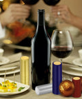 Wine Bottle Cork Stopper Kit With Dope PVC Heat Shrink Capsules, 60 Pcs in 5 Colors displayed with wine and dining setup