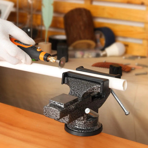 Universal Bench Vise Clamp On Tool With 3.15 Inch Jaw And 360 Degree Swivel Base in use securing a pipe for cutting