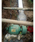 1000W Hydroelectric Water Turbine Generator 220V Off Grid Power System installed outdoors near river bank