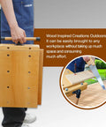 Person carrying Portable Workbench With Sturdy Beech Vise Includes Wood Clamp Four Bench Dogs And Two Clips Extendable Sides