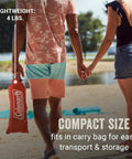 Lightweight Beach Shade Tent With Pre Attached Poles Large Sun Shelter in compact carry bag held by couple on beach